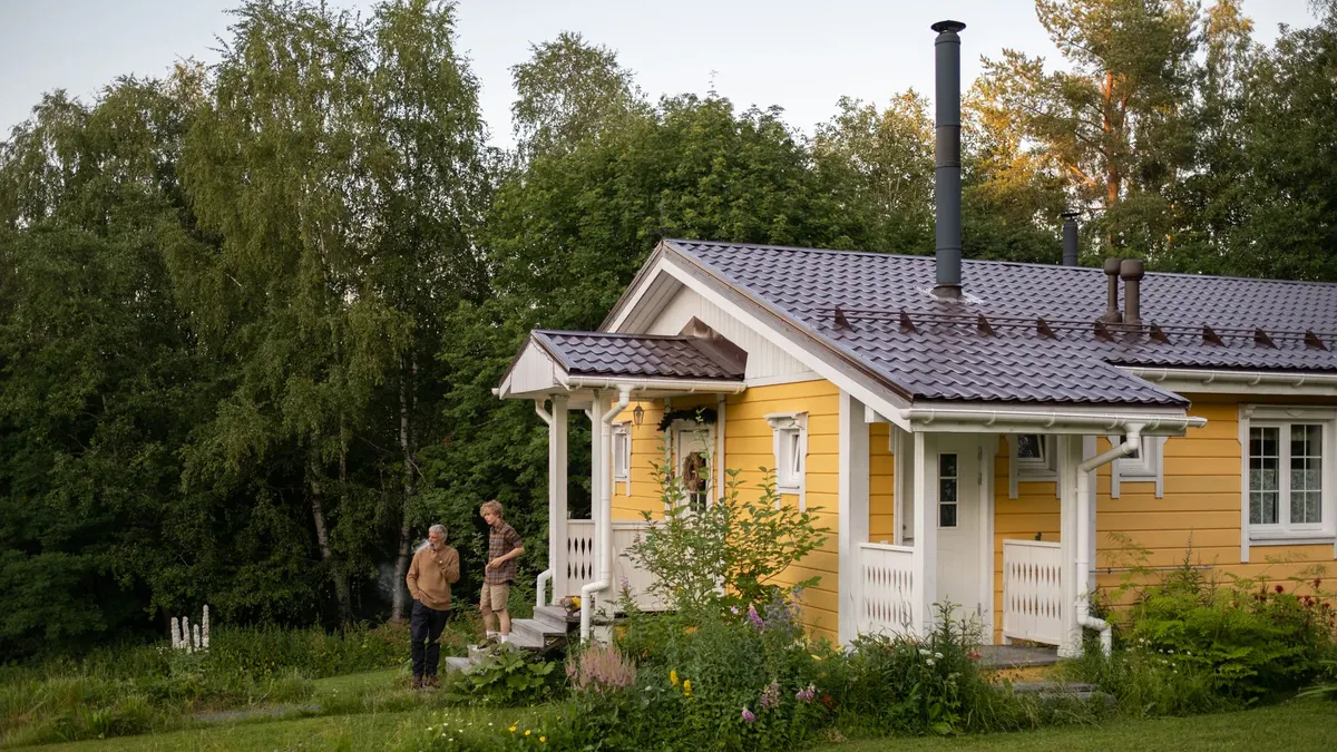 Yellow house and garden on a sunny summer day