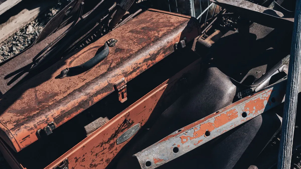 Rusty metal toolbox with worn paint