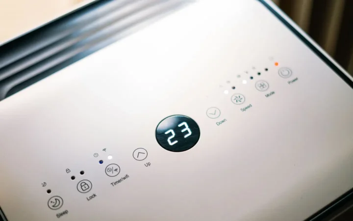 Close-up of a dehumidifier control panel with a digital display