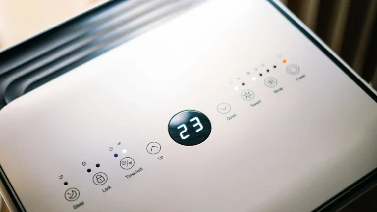 Close-up of a dehumidifier control panel with a digital display