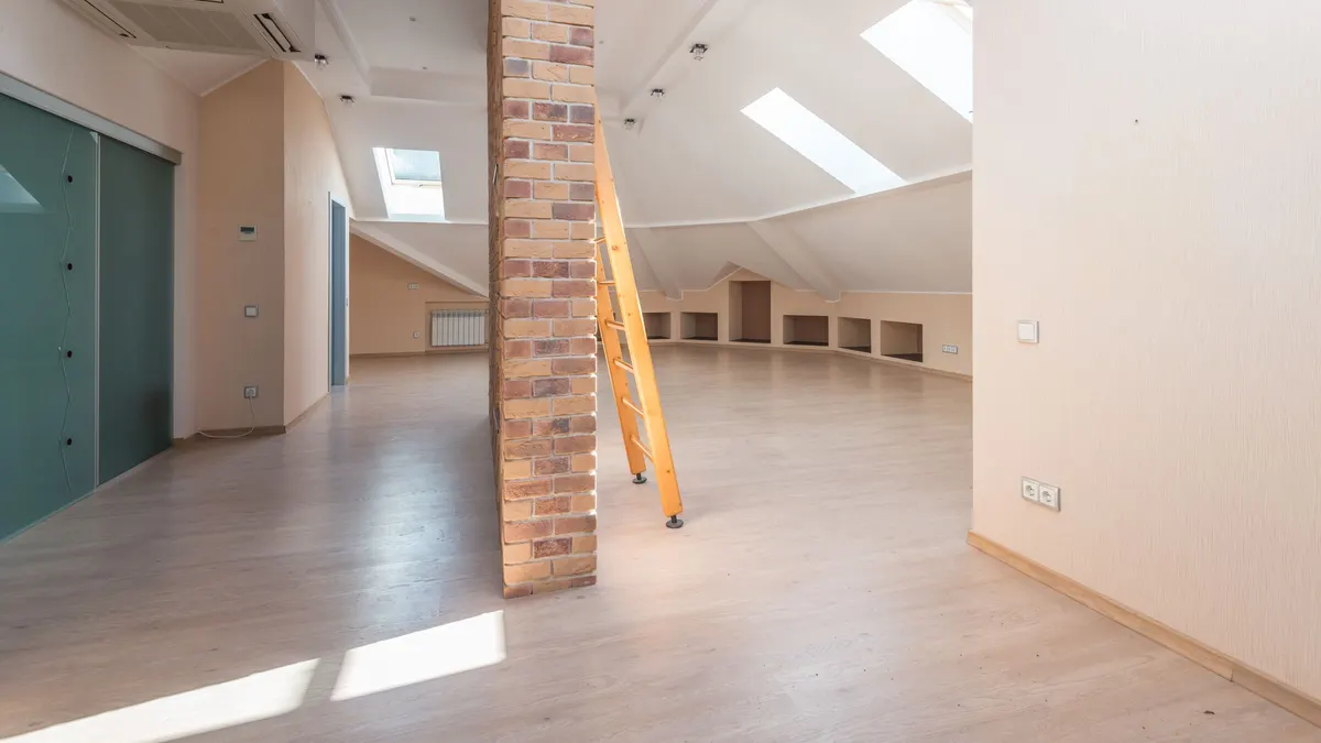 Bright finished attic room with skylights