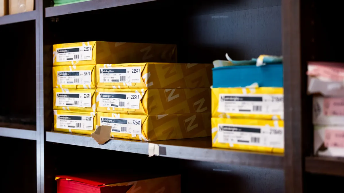 Labeled boxes stacked on a shelf