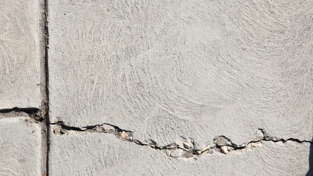 Close-up of a crack running across a concrete floor