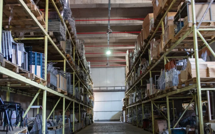 Tall storage racks stacked with boxes up to the ceiling