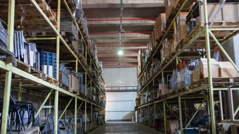 Tall storage racks stacked with boxes up to the ceiling