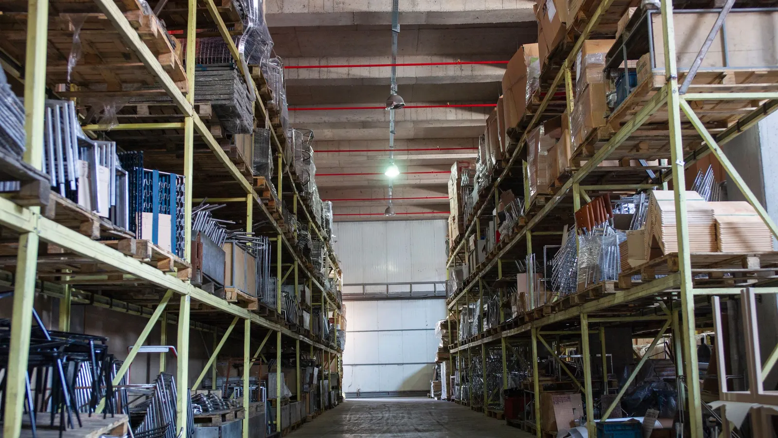 Tall storage racks stacked with boxes up to the ceiling