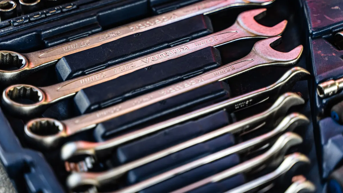 Wrenches arranged in a fitted tool case tray